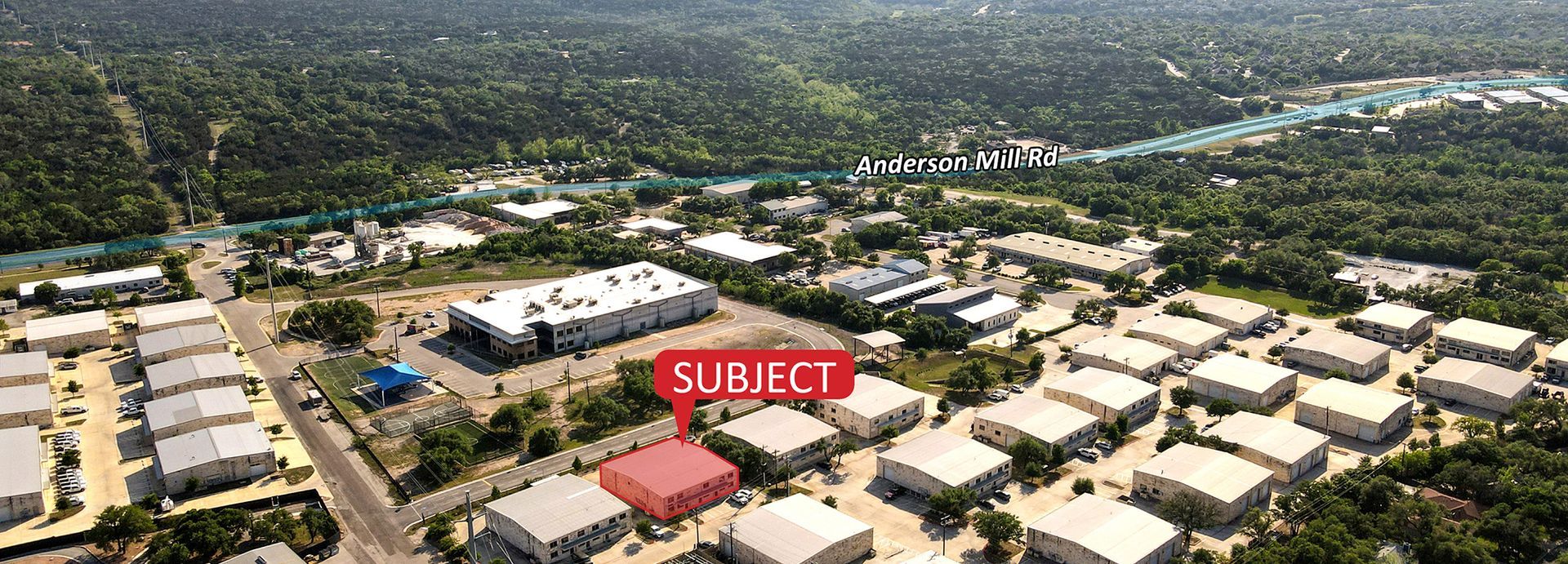 An aerial view of a city with a red sign that says subject.