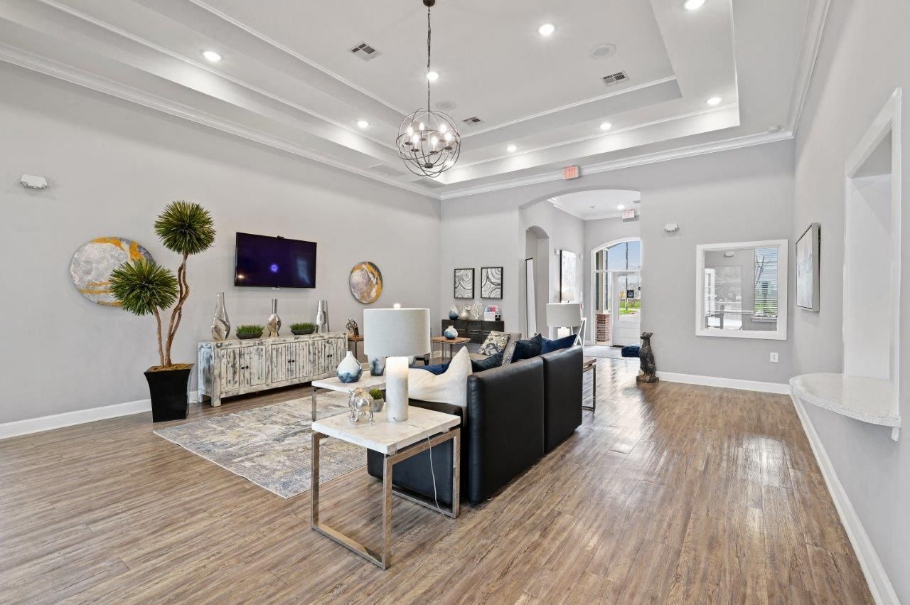 A living room with a couch , table , and television.