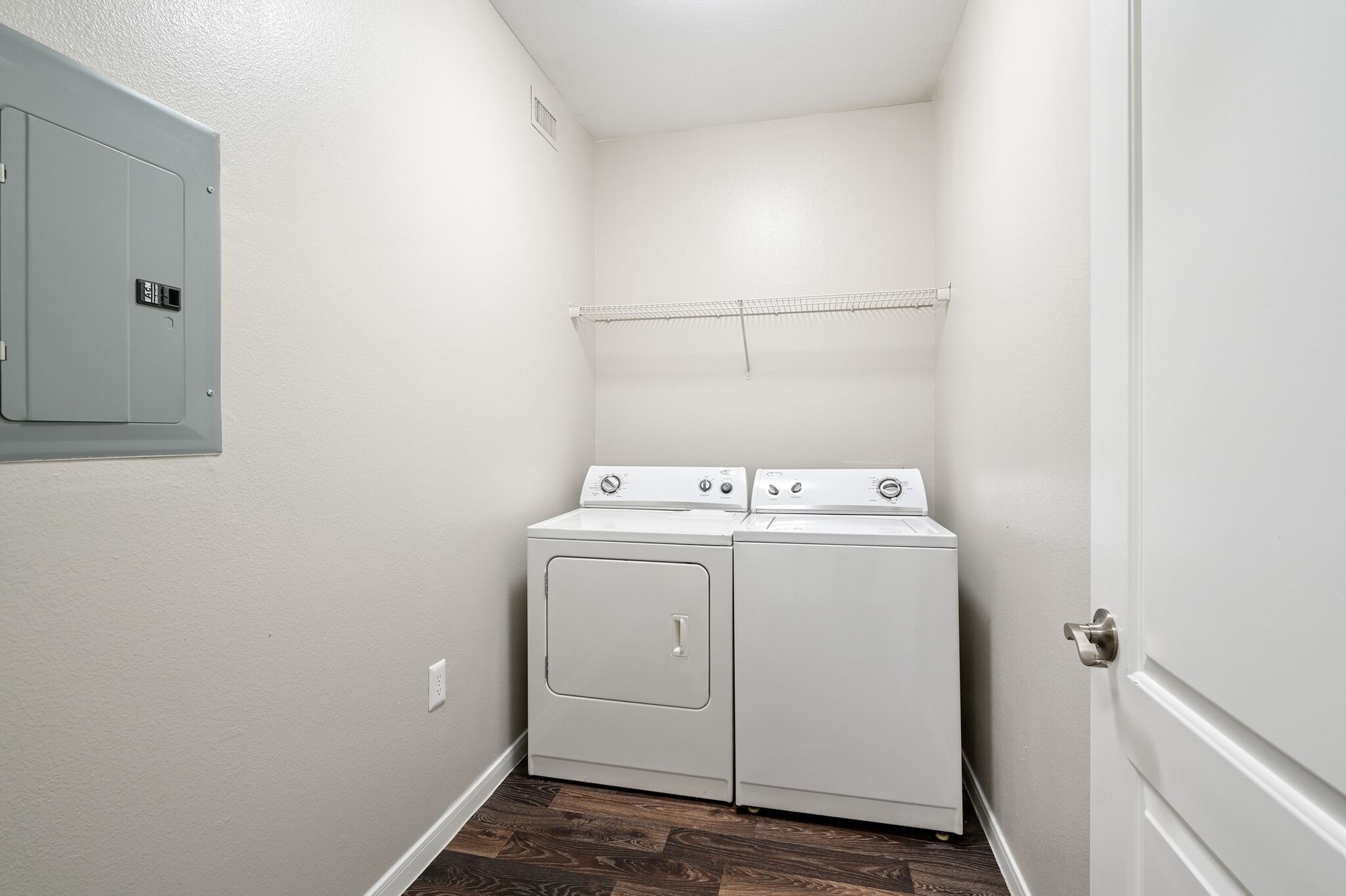 A laundry room with a washer and dryer in it.