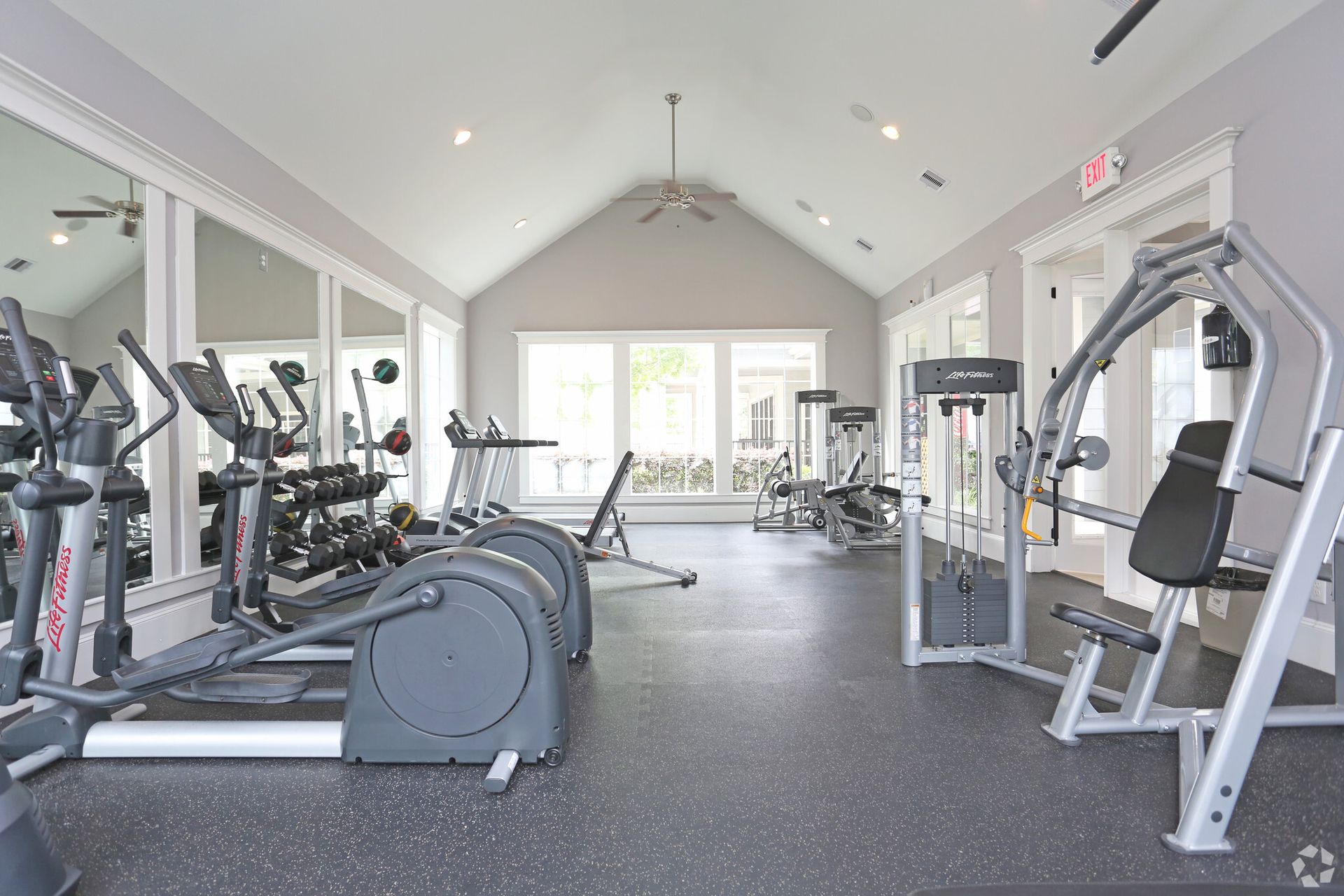 A large gym with a lot of exercise equipment