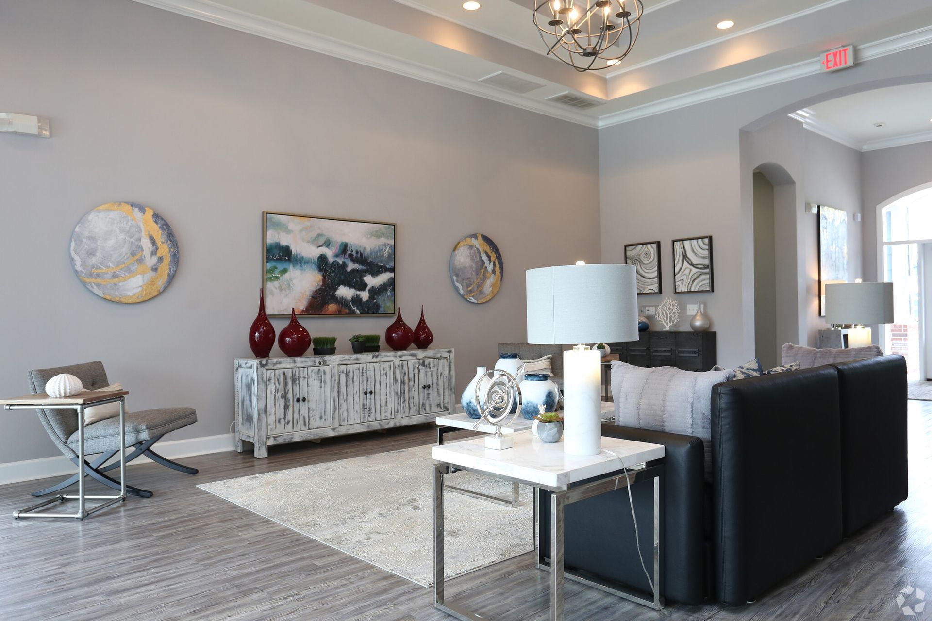 A living room filled with furniture and a chandelier.