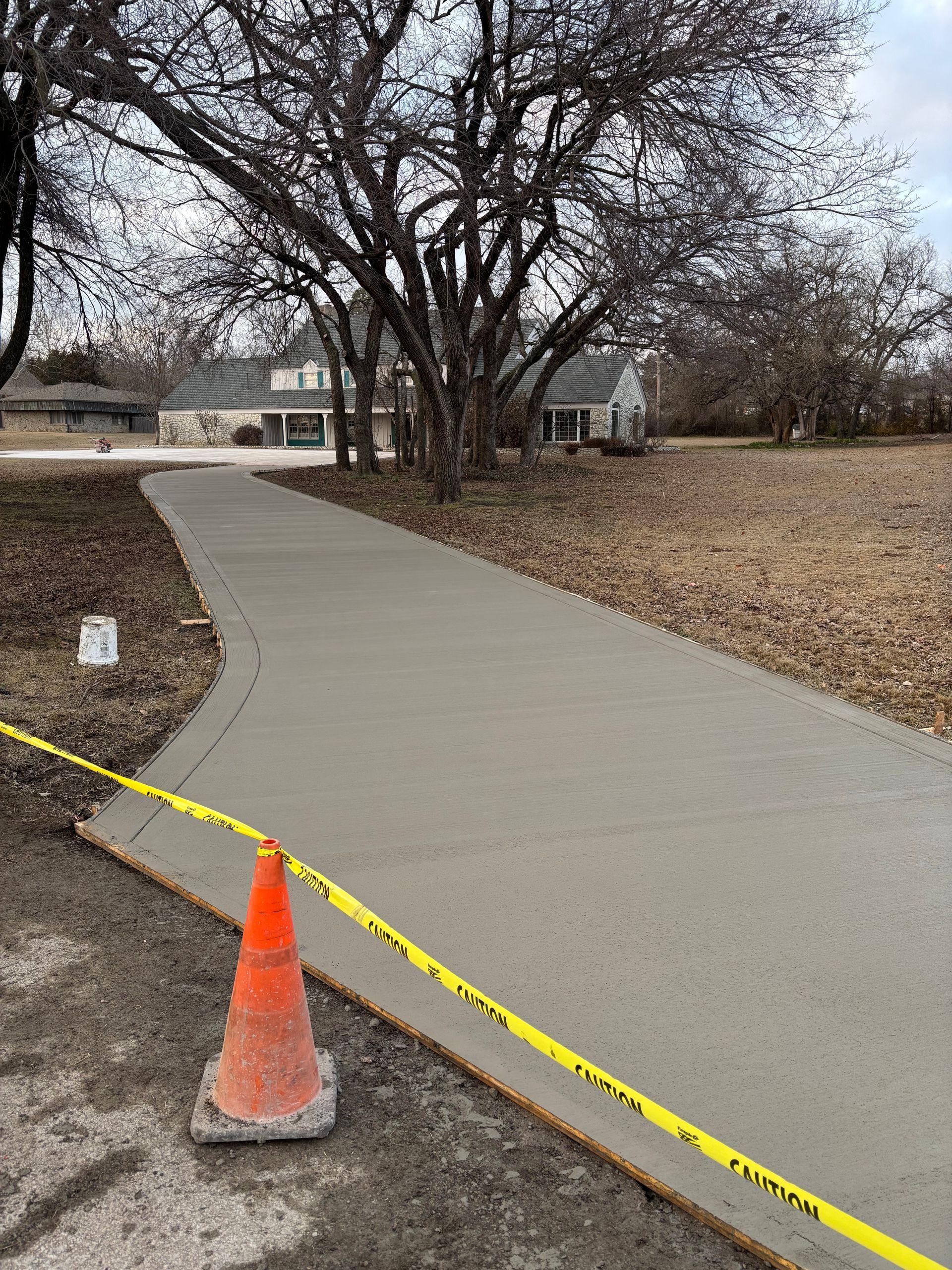 Gray brick wall with textured surface and visible mortar joints.