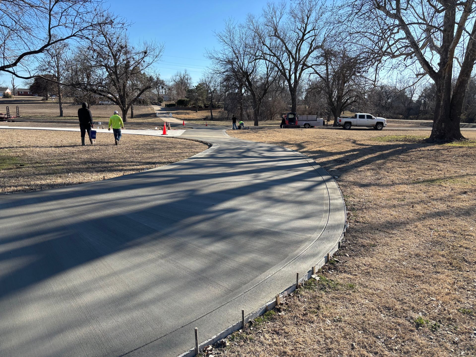 Close-up of a rough, mottled gray surface, possibly concrete or stone, with a textured appearance.