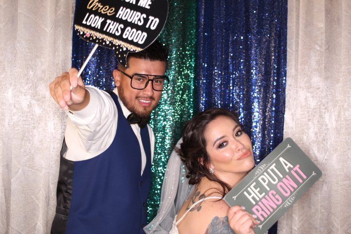 Two party goers posting before a Photo Booth rental in Dallas-Fort Worth