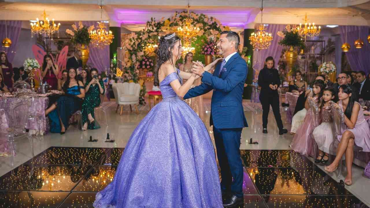 The daughter and her father share a dance.