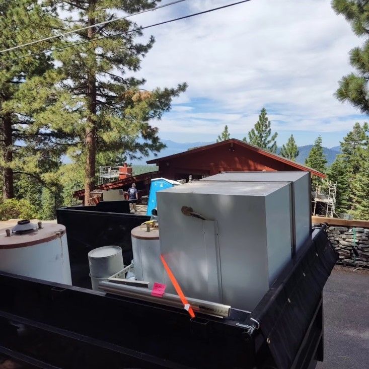 A truck with a few boxes in the back of it