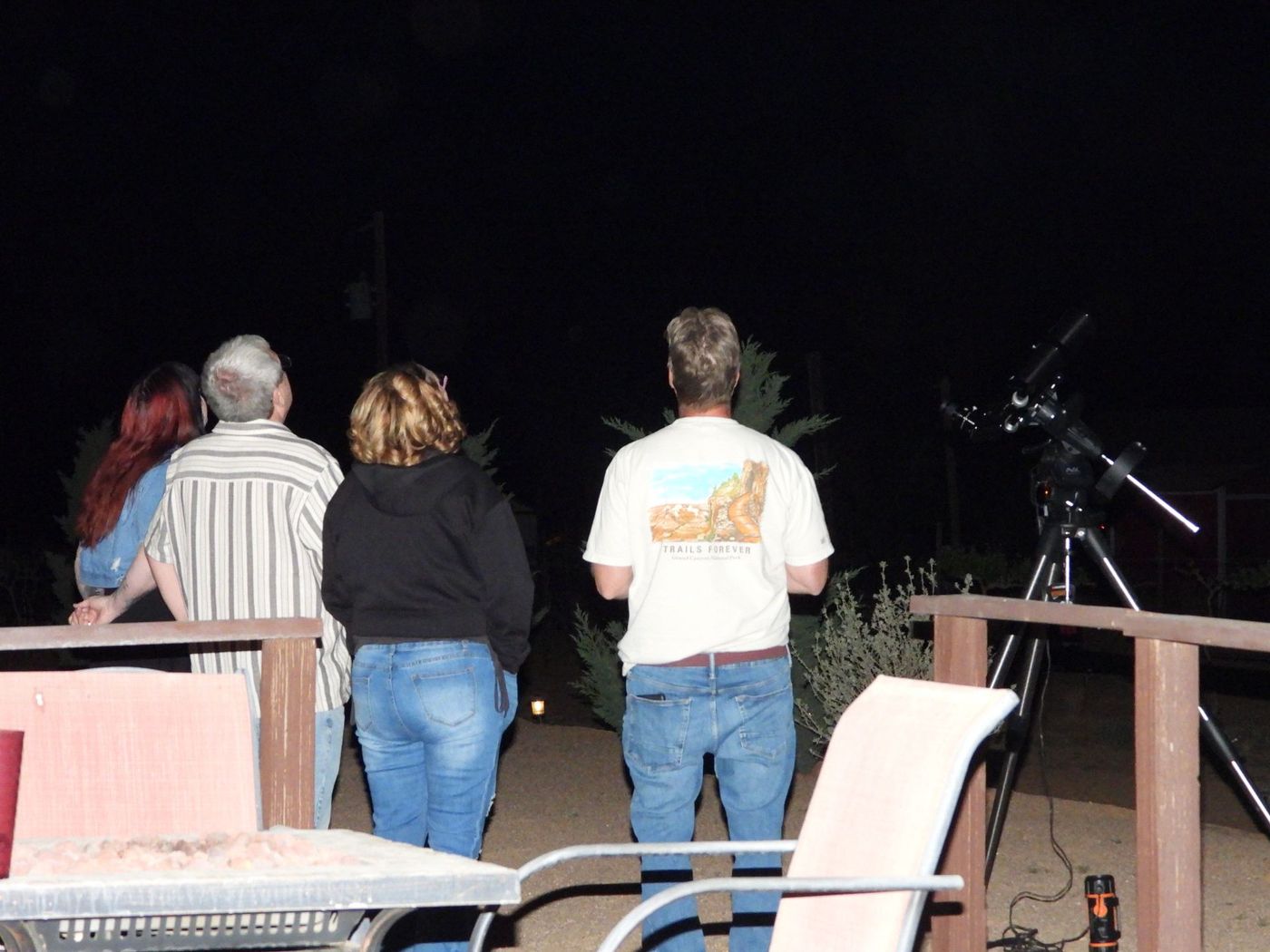People looking up at universe.