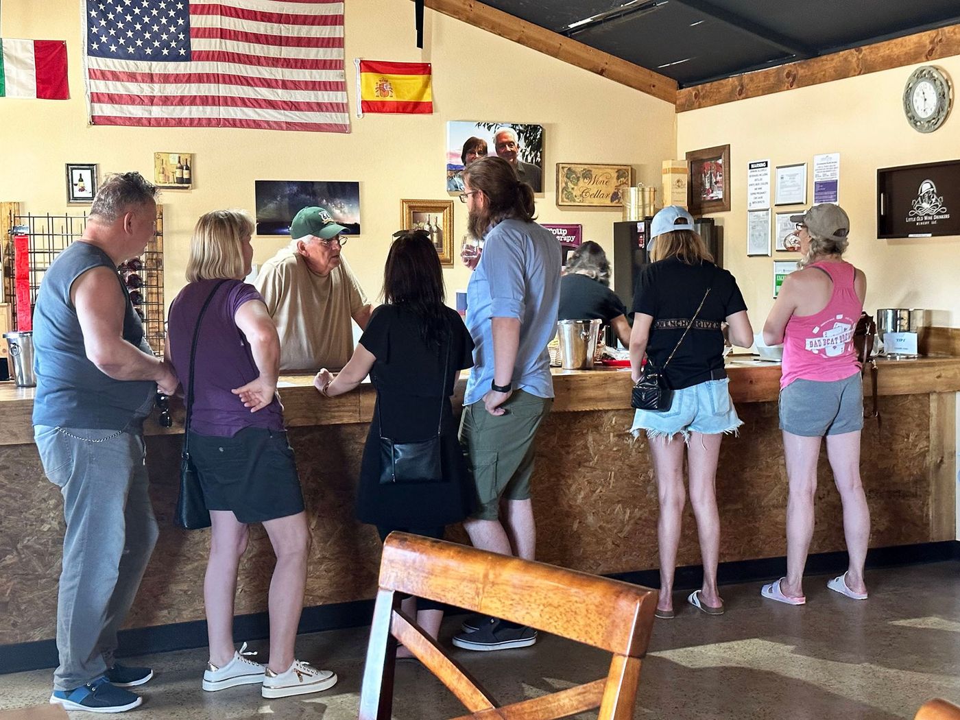 Man discussing wine making to group.