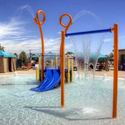 A water park with a blue slide and orange poles