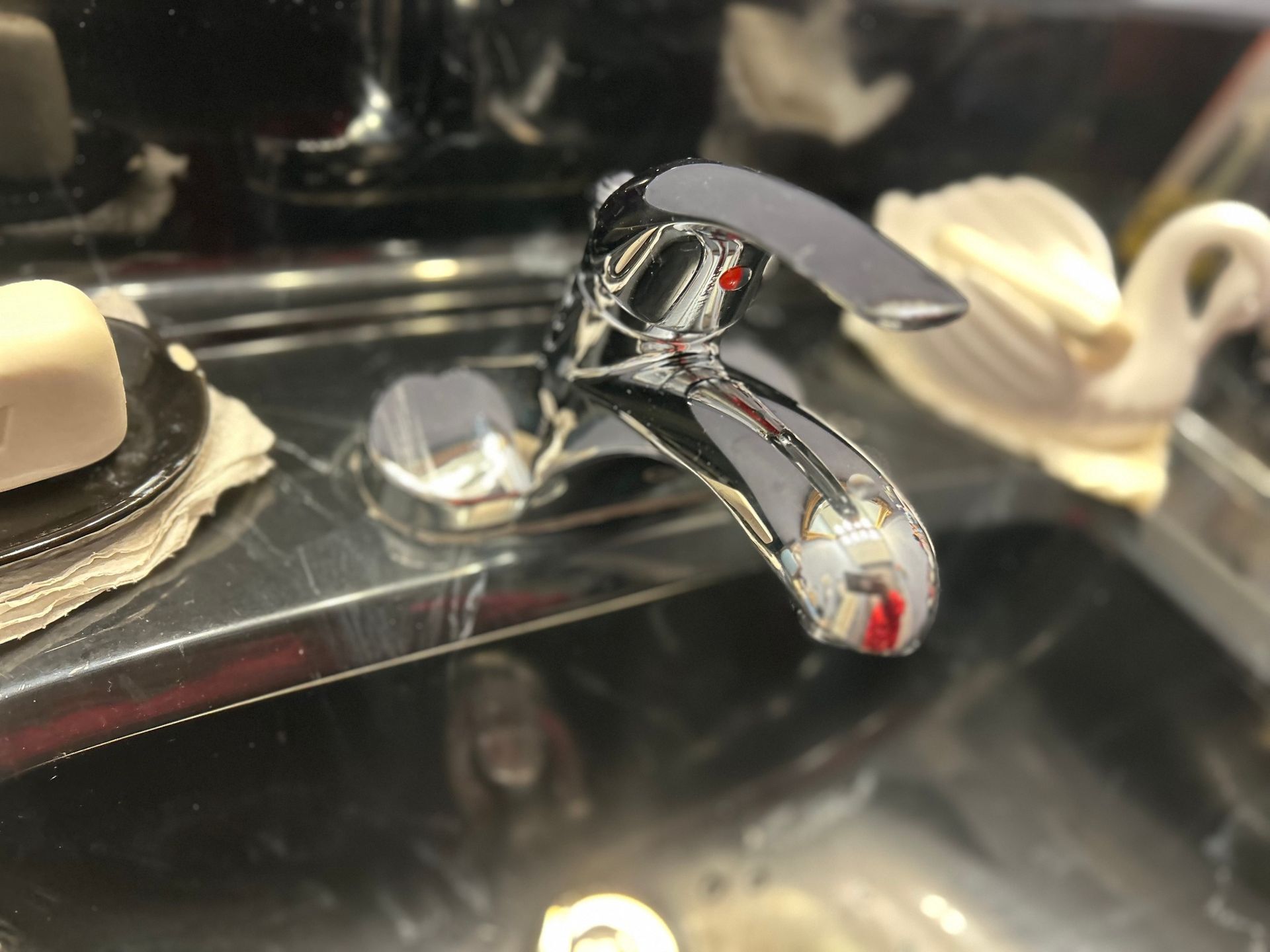 A close up of a faucet in a bathroom sink