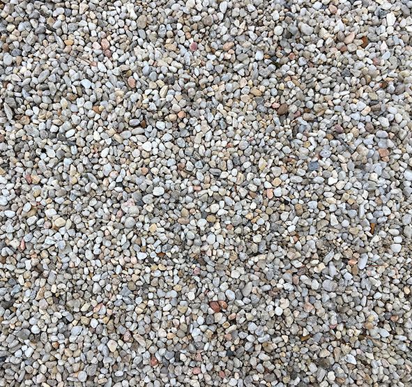 a pile of gravel is sitting on the ground .