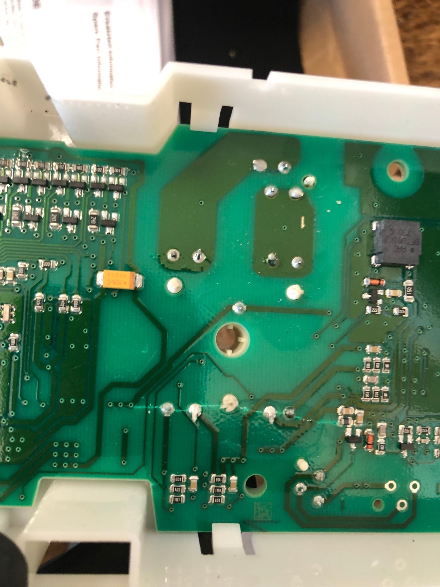 a close up of a green and white motherboard