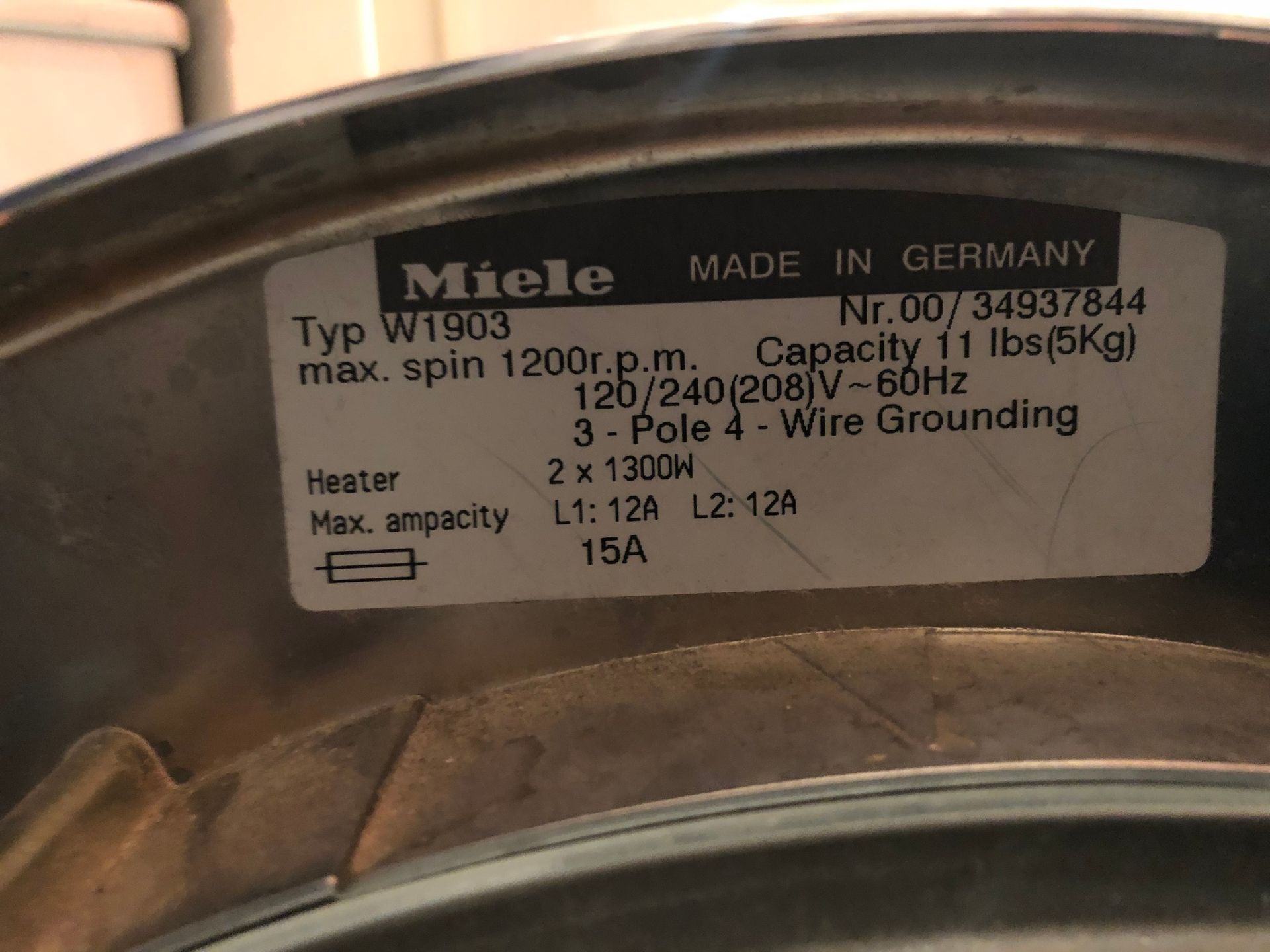 a close up of a label on a miele washing machine