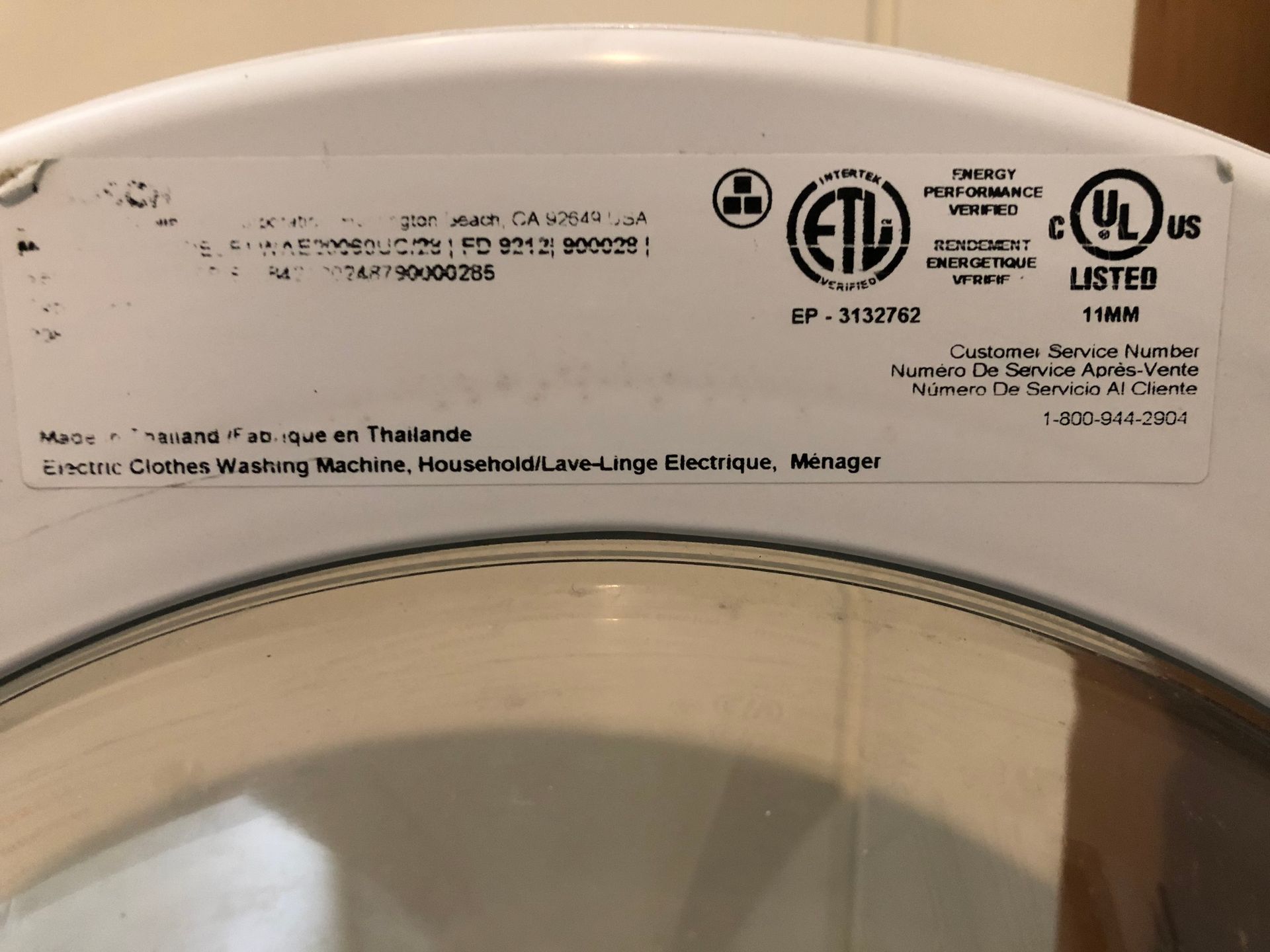 a white washing machine with a label that says ul listed