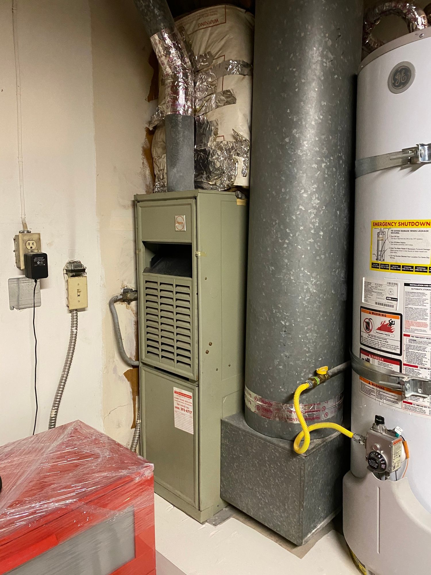 a room with a heater and a water heater in it .