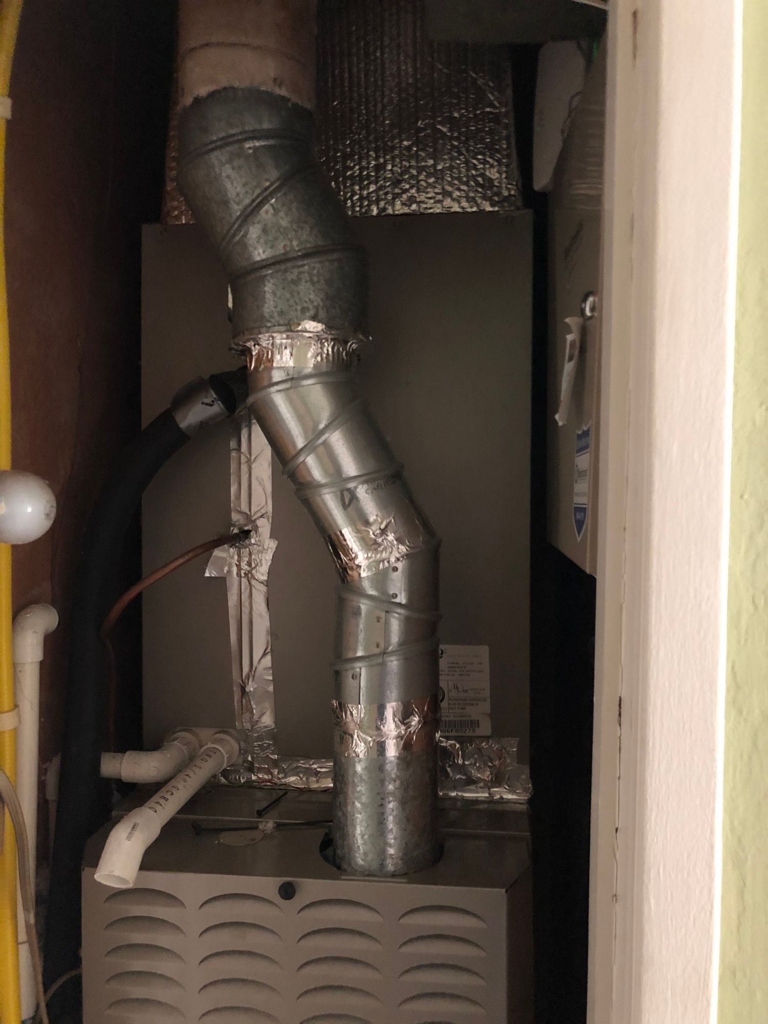 a close up of a heater with a pipe coming out of it .