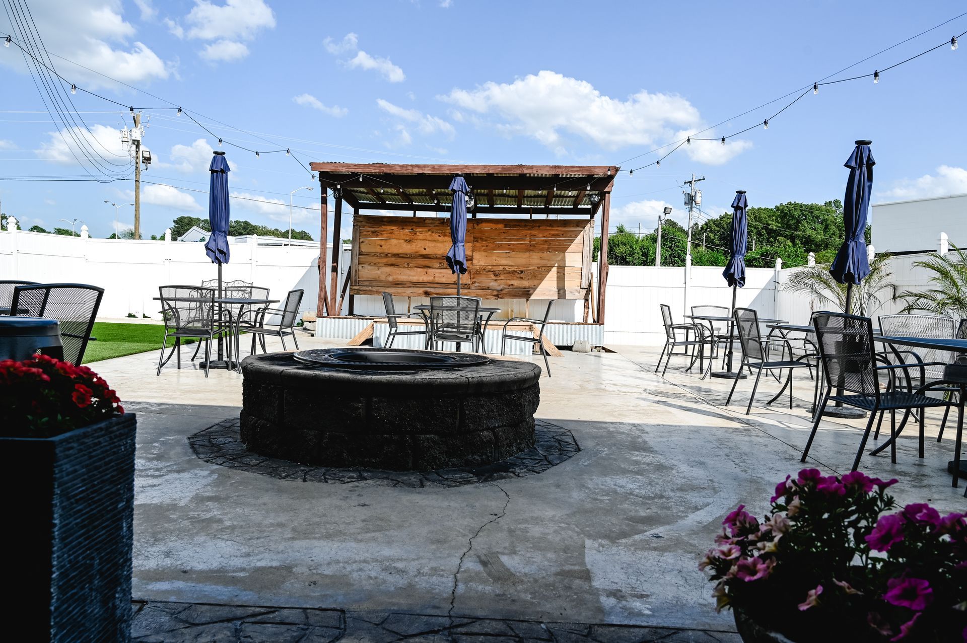 A crowd of people raising their hands in the air at a concert.