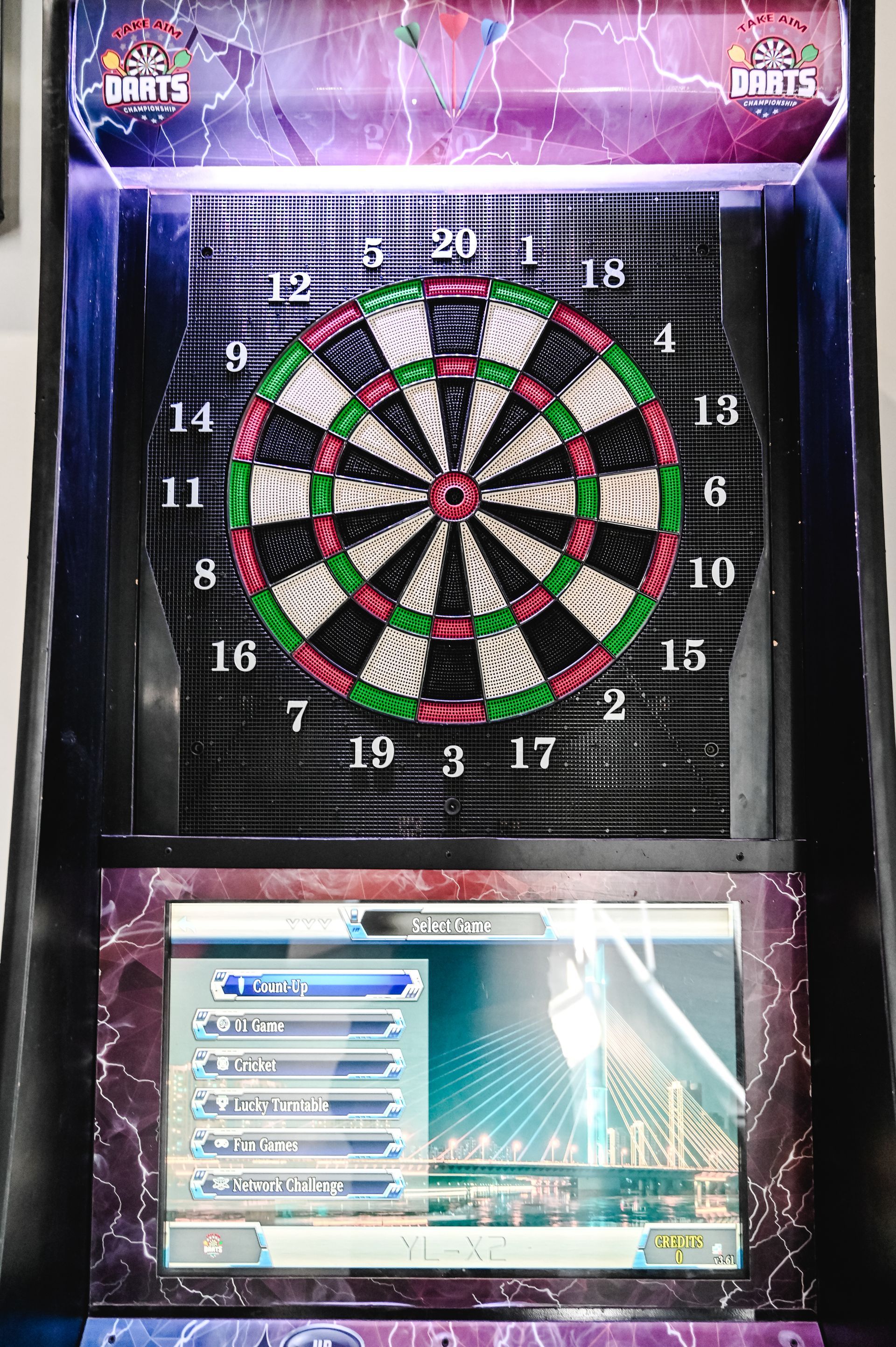 A dart board with a screen on top of it.