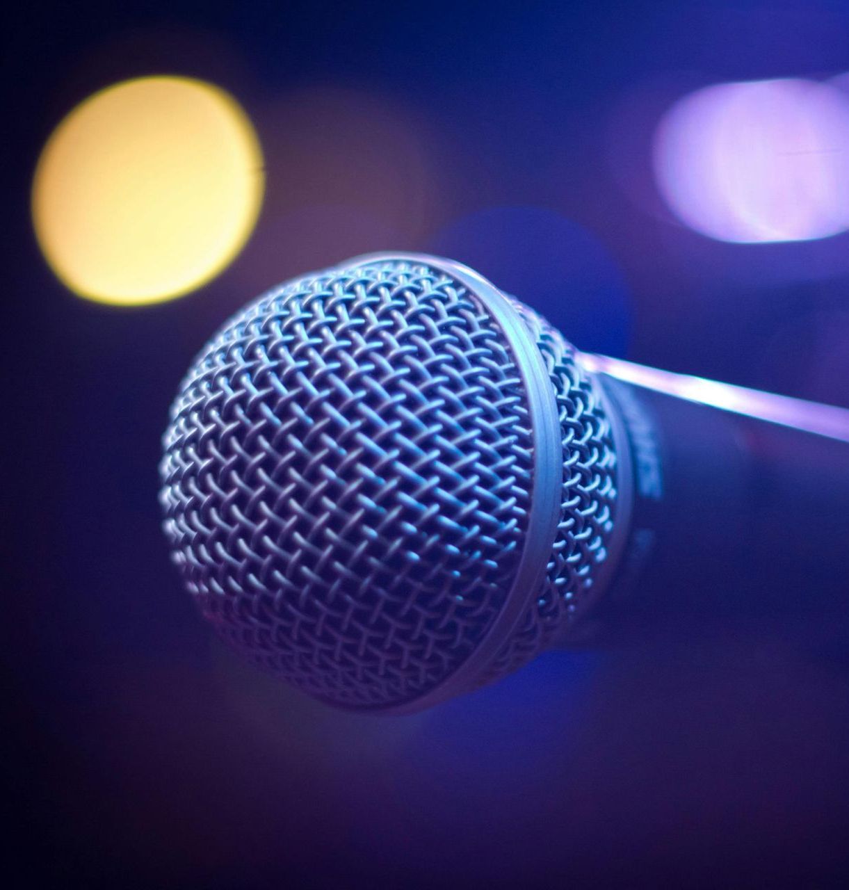 A close up of a microphone in a dark room