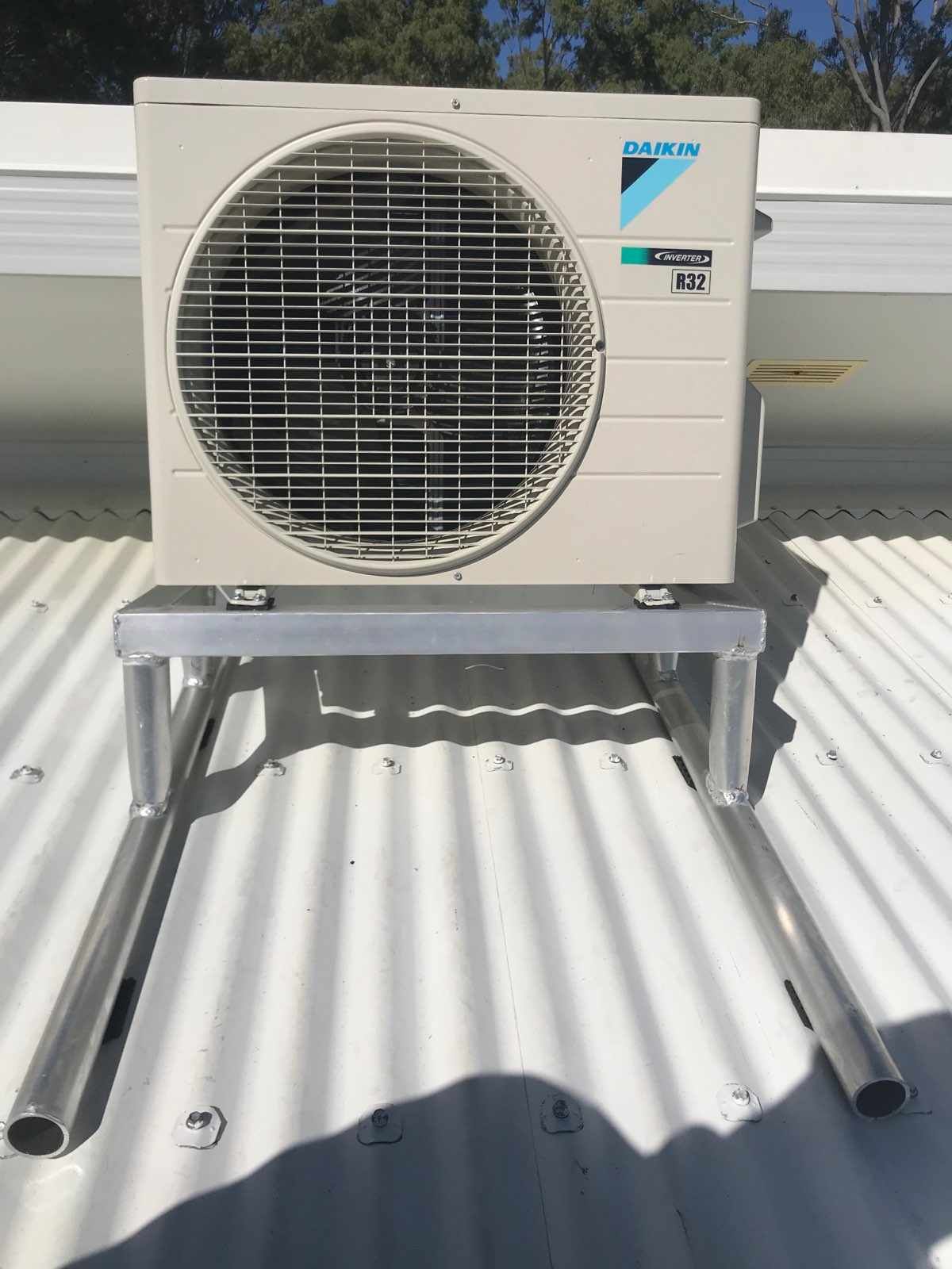 A Daikin Air Conditioner Is Sitting on Top of A Roof — McGuire Air & Refrigeration In Paget, QLD