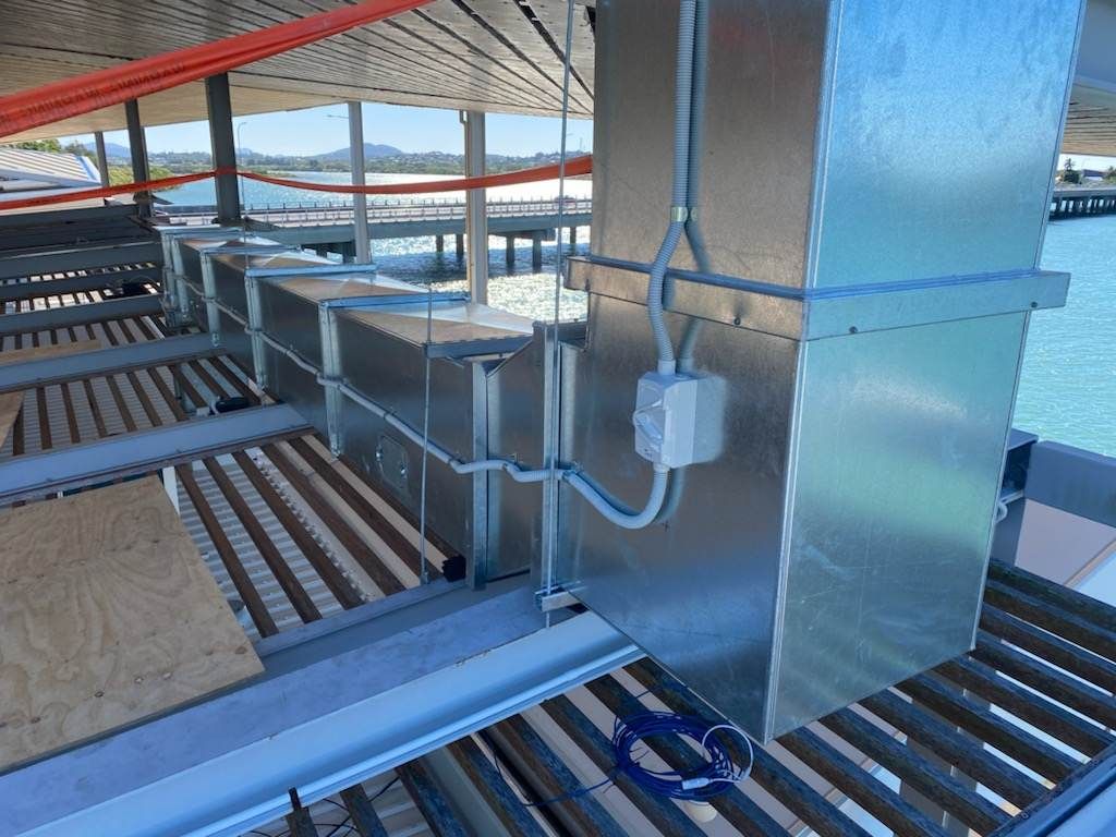 A Building with A Lot of Wires Coming out Of It — McGuire Air & Refrigeration In Paget, QLD