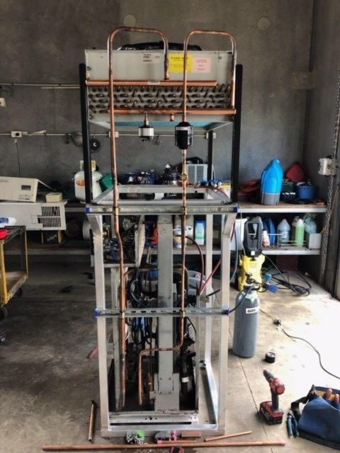 A Machine that Is Being Worked on In a Garage — McGuire Air & Refrigeration In Paget, QLD