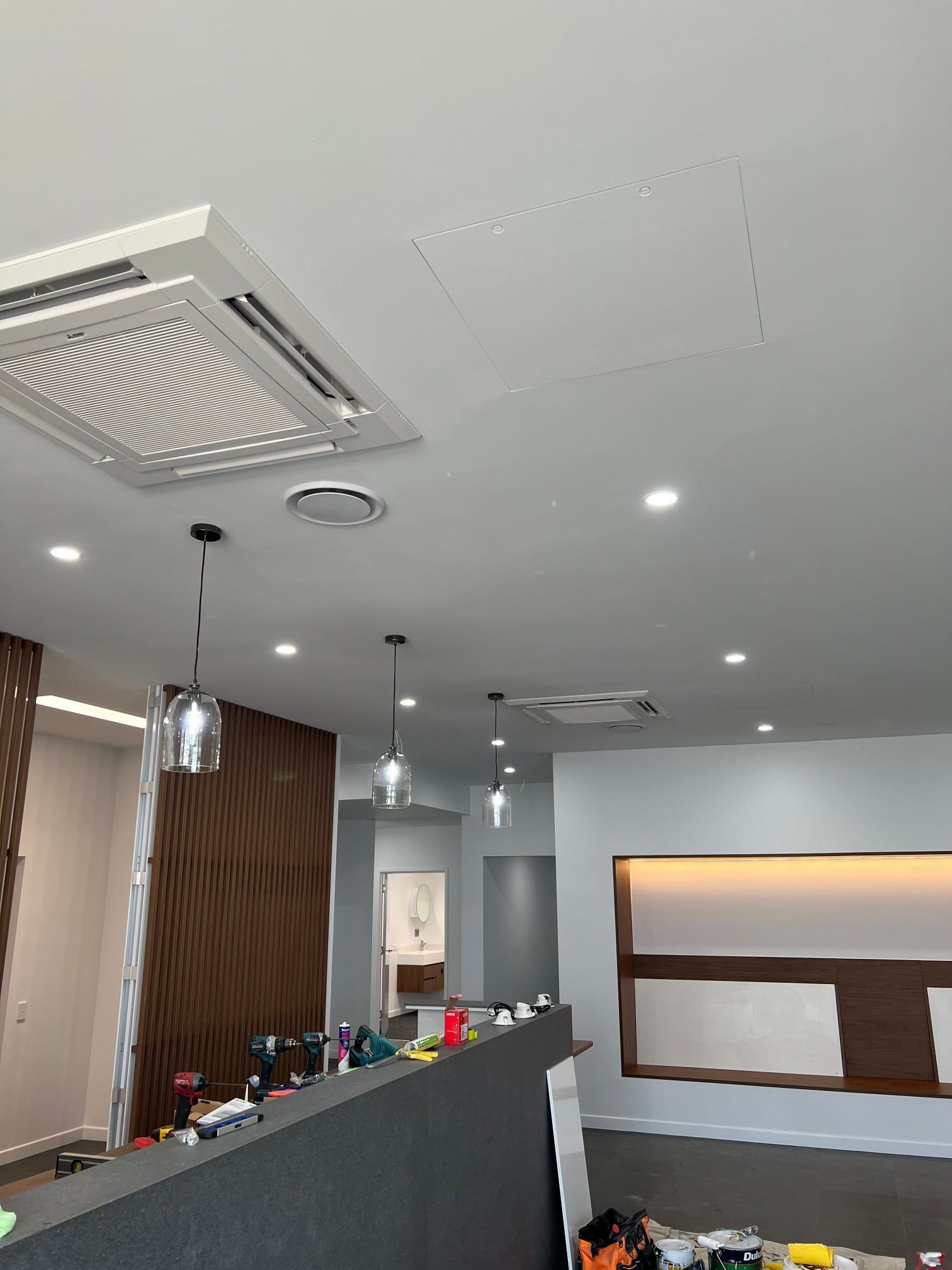 Two Air Conditioners Are Mounted on The Side of A Building — McGuire Air & Refrigeration In Sarina, QLD