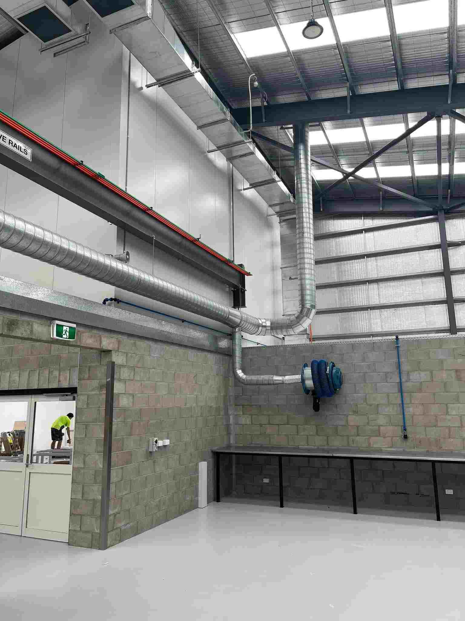 A Large Warehouse with A Lot of Pipes Coming out Of the Ceiling — McGuire Air & Refrigeration in Proserpine, QLD