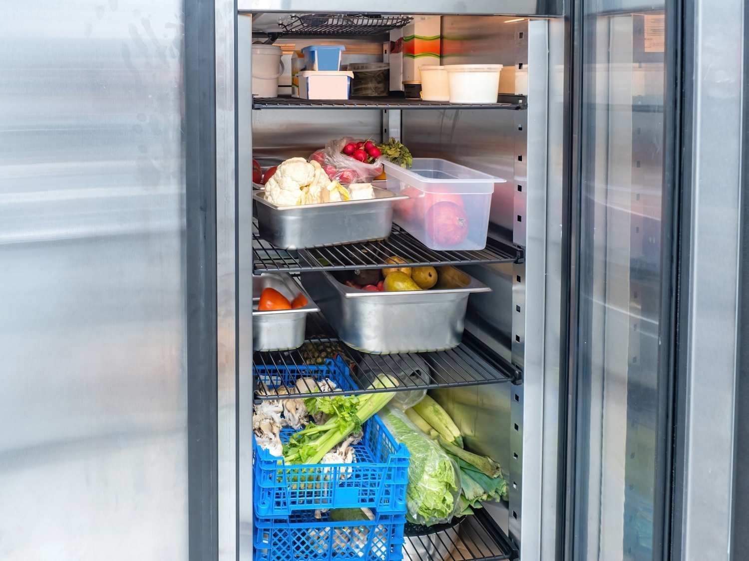 A Stainless Steel Refrigerator Filled with Vegetables and Fruits — McGuire Air & Refrigeration in Proserpine, QLD