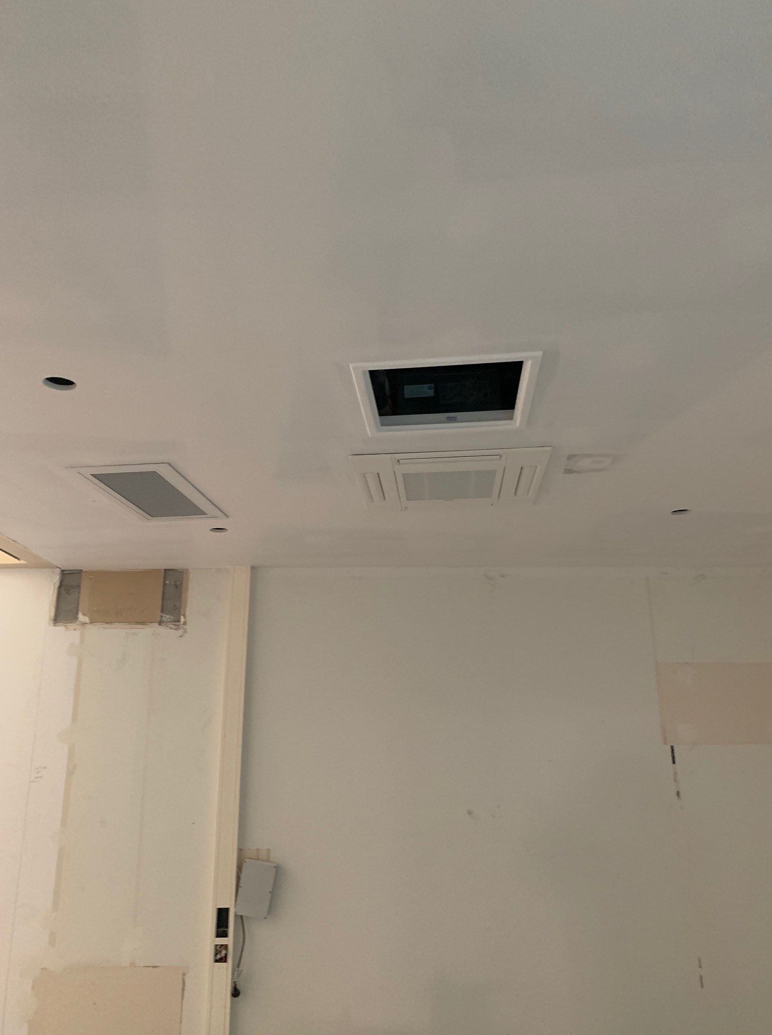 A White Room with A Ceiling Fan and A Door — McGuire Air & Refrigeration in Moranbah, QLD