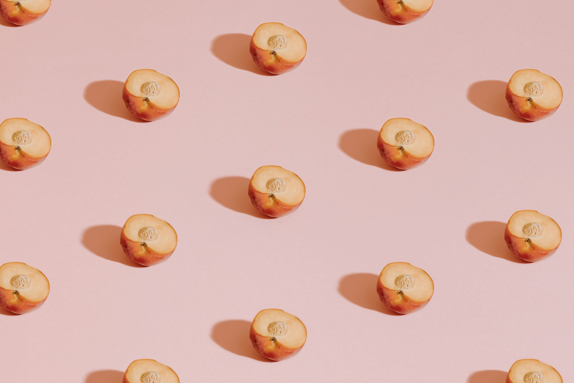 Peaches on a pink background for a cheeky talk about anal sex. 