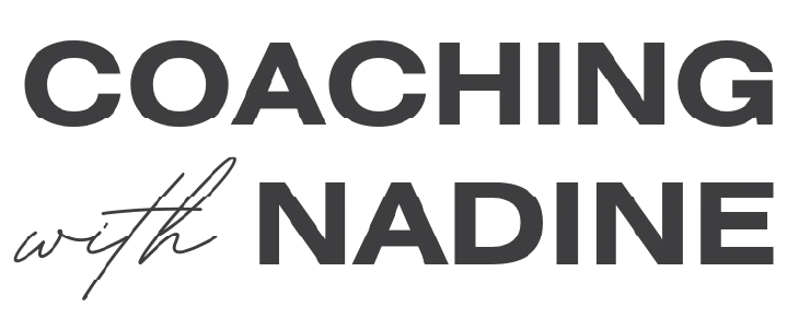 The logo for coaching with nadine is black and white.