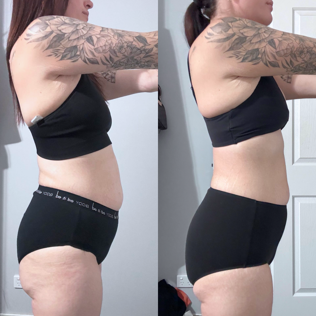 A woman with tattoos on her arms is standing in front of a door.