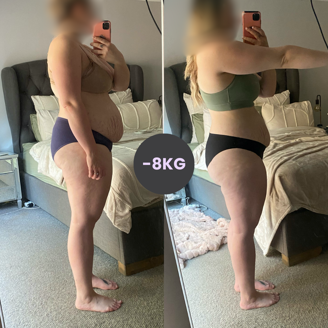 A woman is standing in front of a bed and taking a picture of herself.