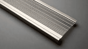 A close up of a metal grate on a table.