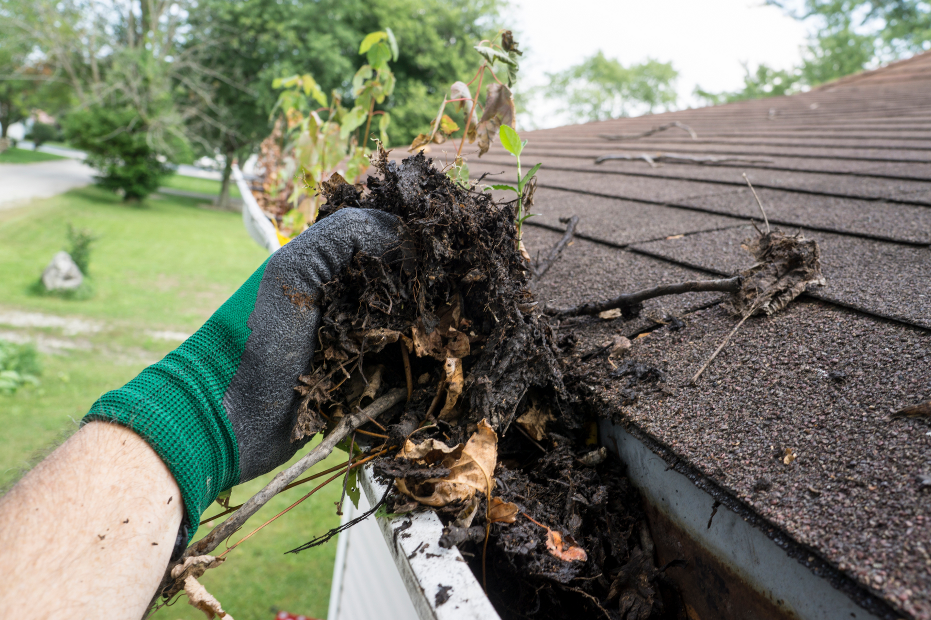 Man's Hand Cleaning Gutters in Monmouth County NJ