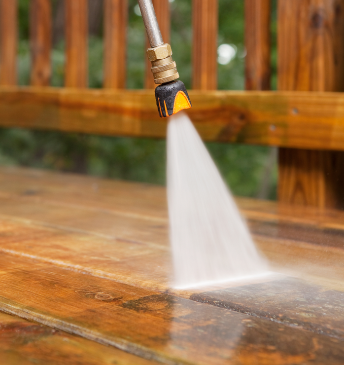 A deck being cleaned with a power washer in Freehold, NJ