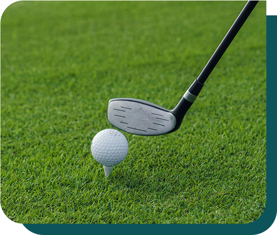 A golf club is hitting a golf ball on a tee