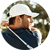 A man wearing a white hat is holding a golf club.