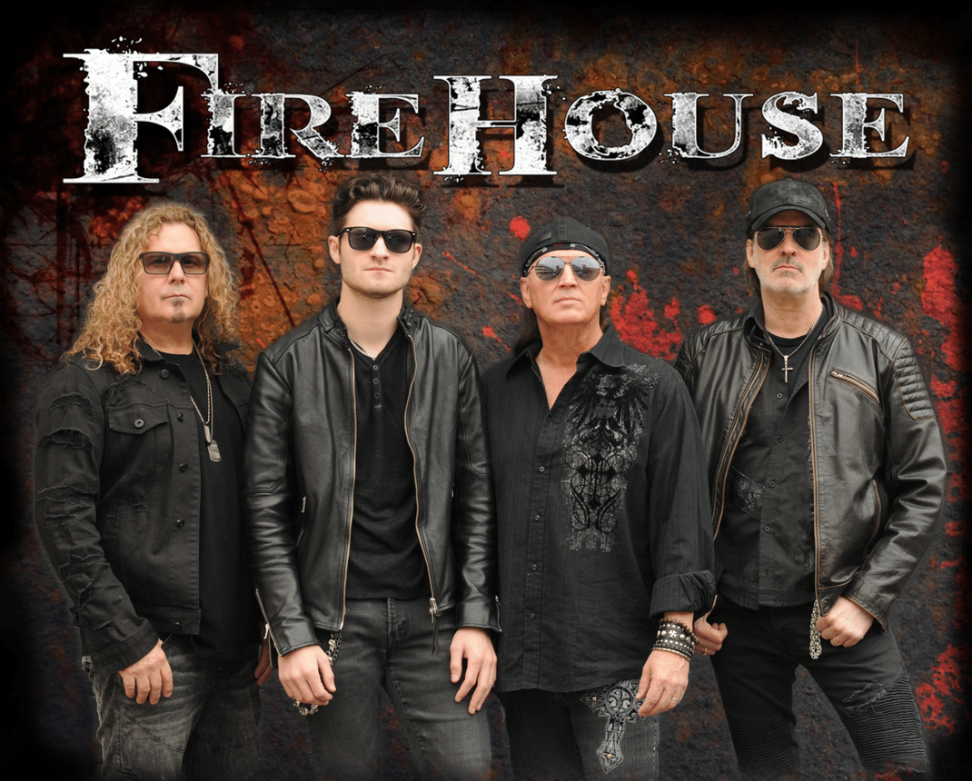 A group of men standing in front of a sign that says firehouse
