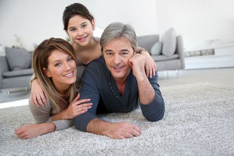 Happy family on carpet cleaned by us in Halifax