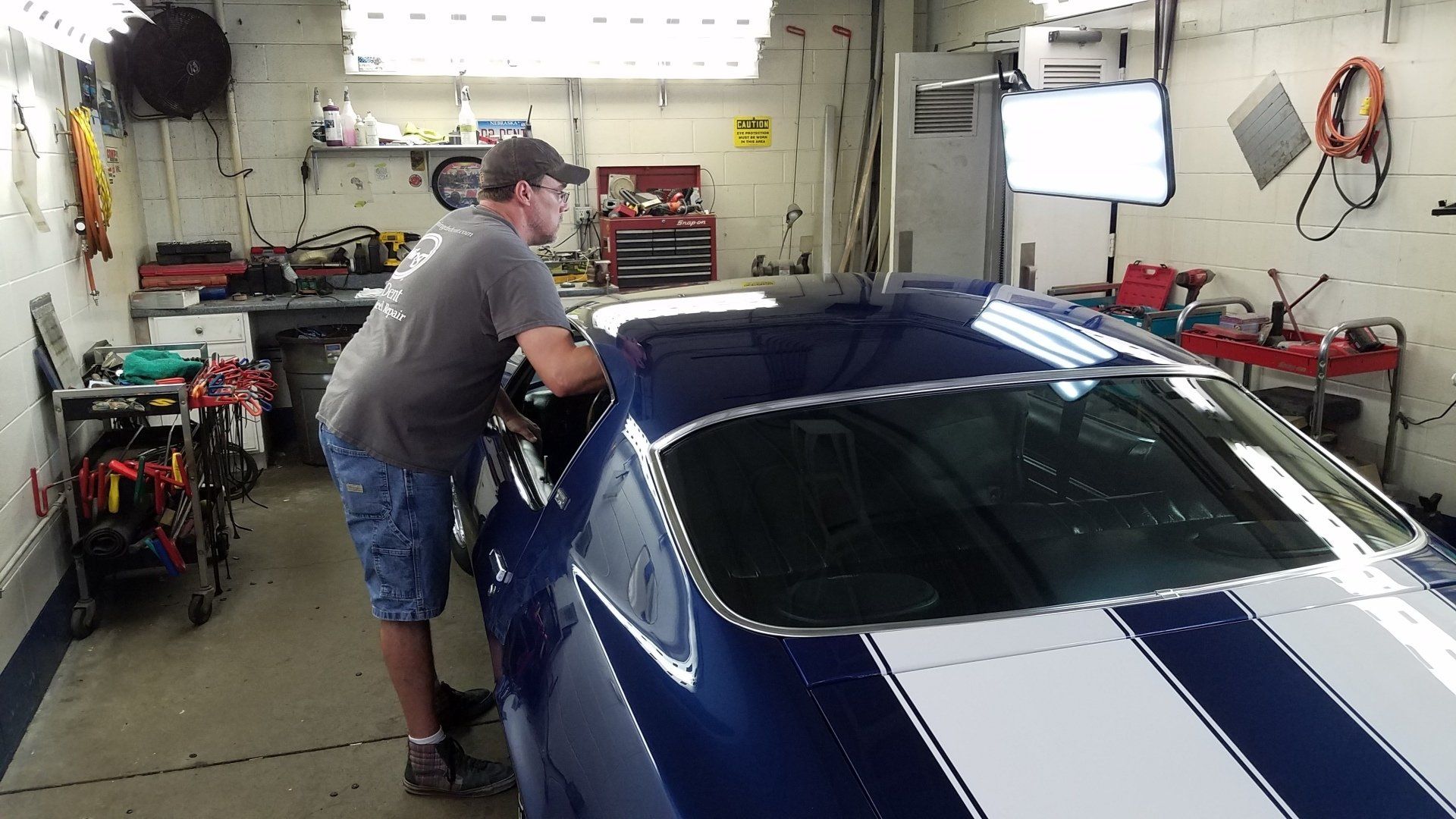Paintless dent repair being applied in Lancaster County, NE