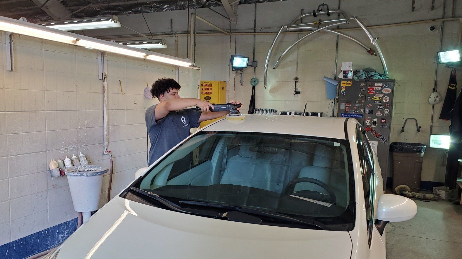A buffing a car's hood after a paint protection service in Lincoln, NE