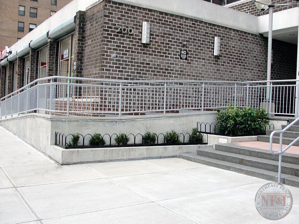 A brick building with a ramp leading up to it