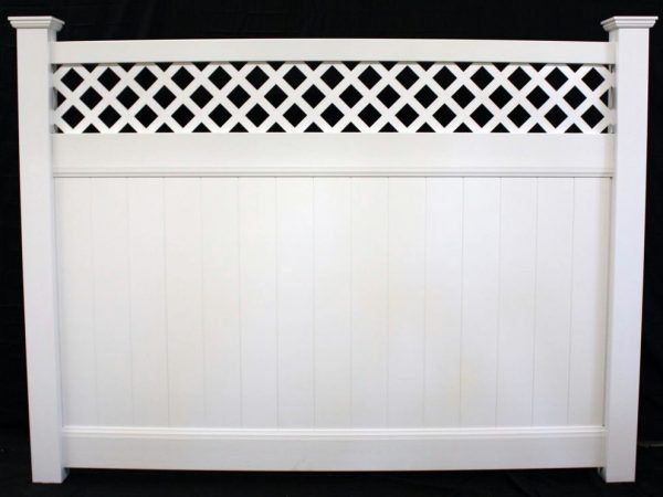 A white lattice fence with a black background