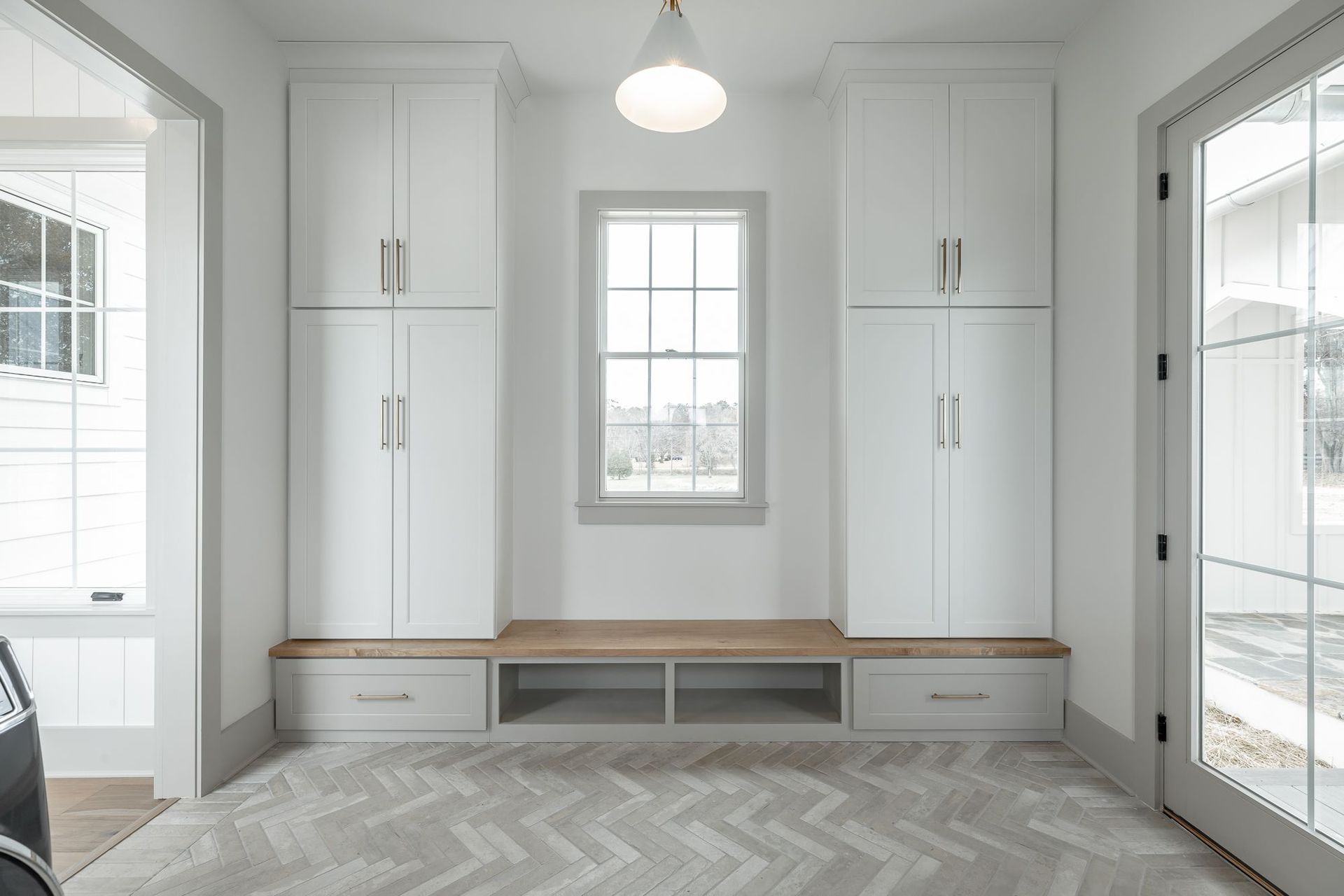 A room with lots of cabinets and a window