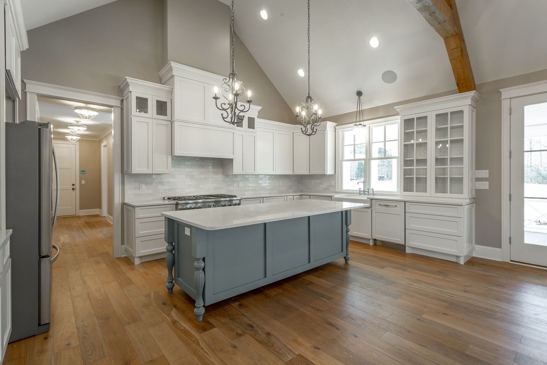 There is a large island in the middle of the kitchen.
