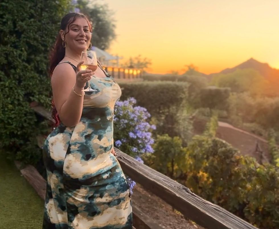 A glass of red wine branded 