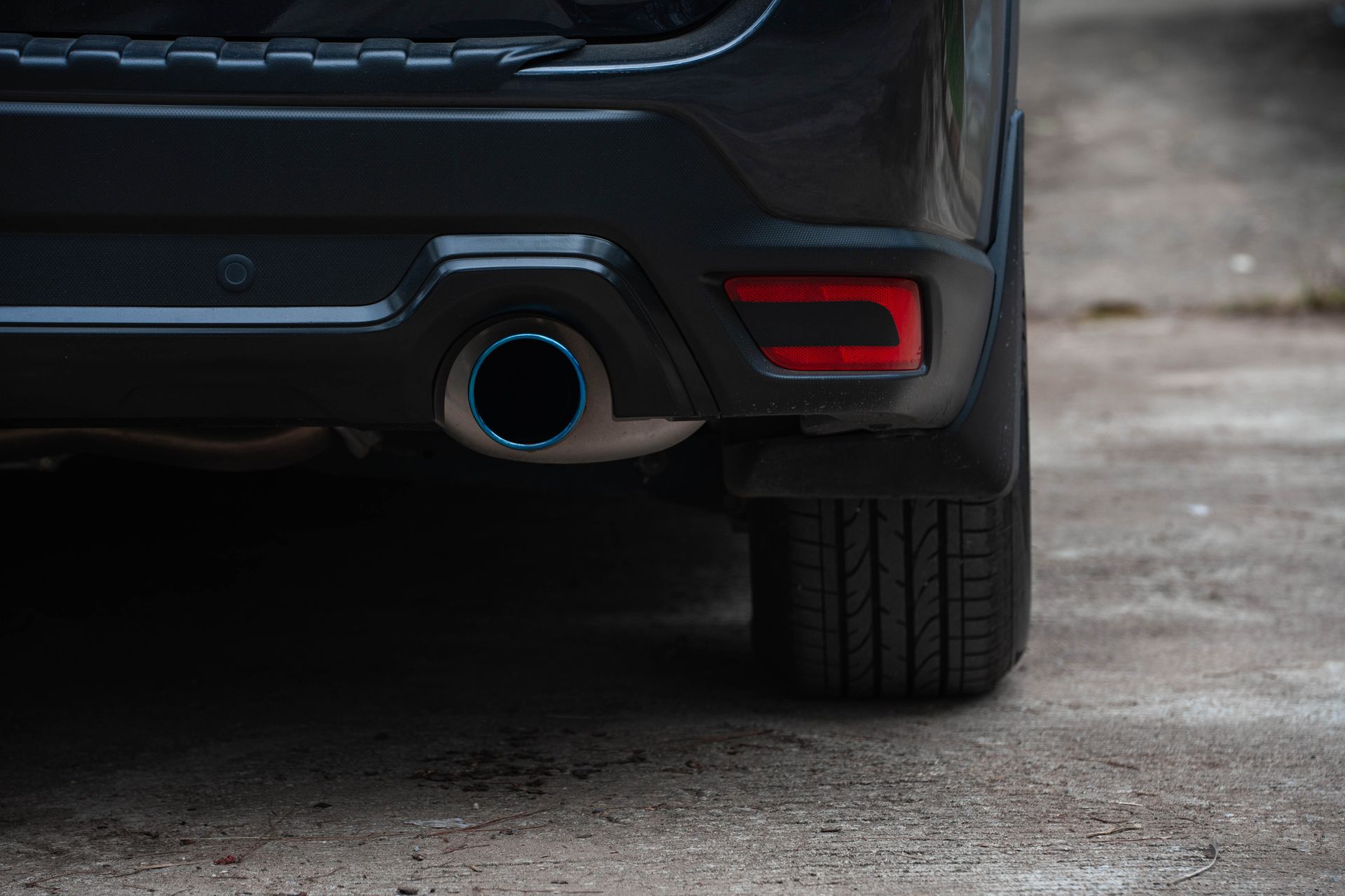 A Close Up of the Exhaust Pipe of a Black Car | Colorado Springs, CO | Locklynn Automotive