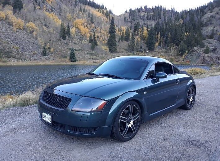 A Green Sports Car is Parked on the Side of the Road Next to a Lake | Colorado Springs, CO | Locklynn Automotive